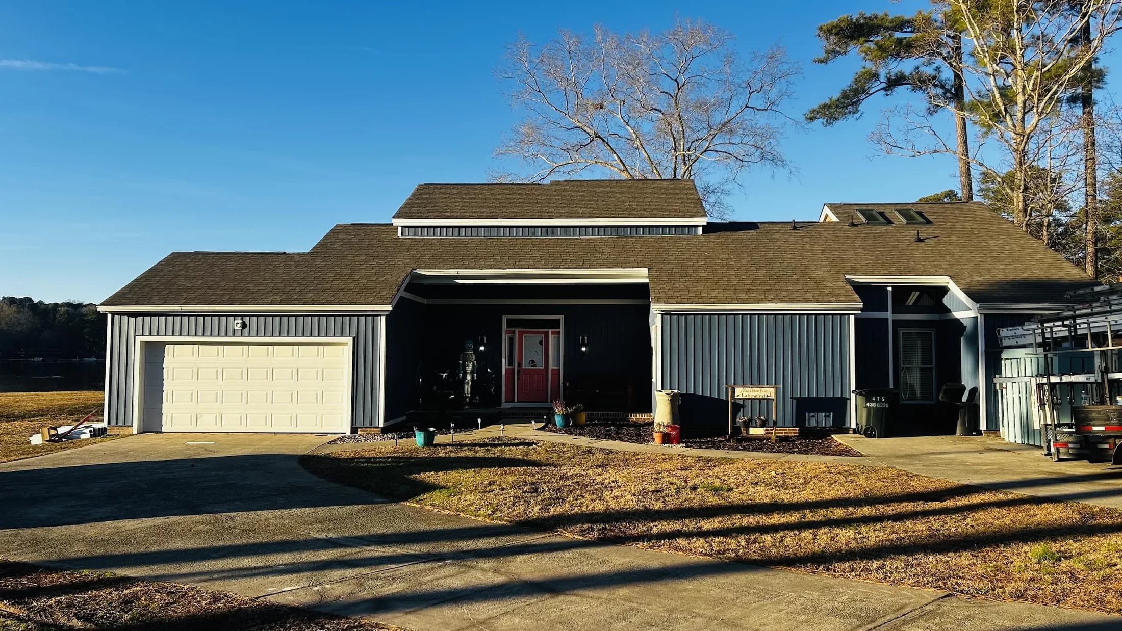 A blue siding transformation — siding after the work.